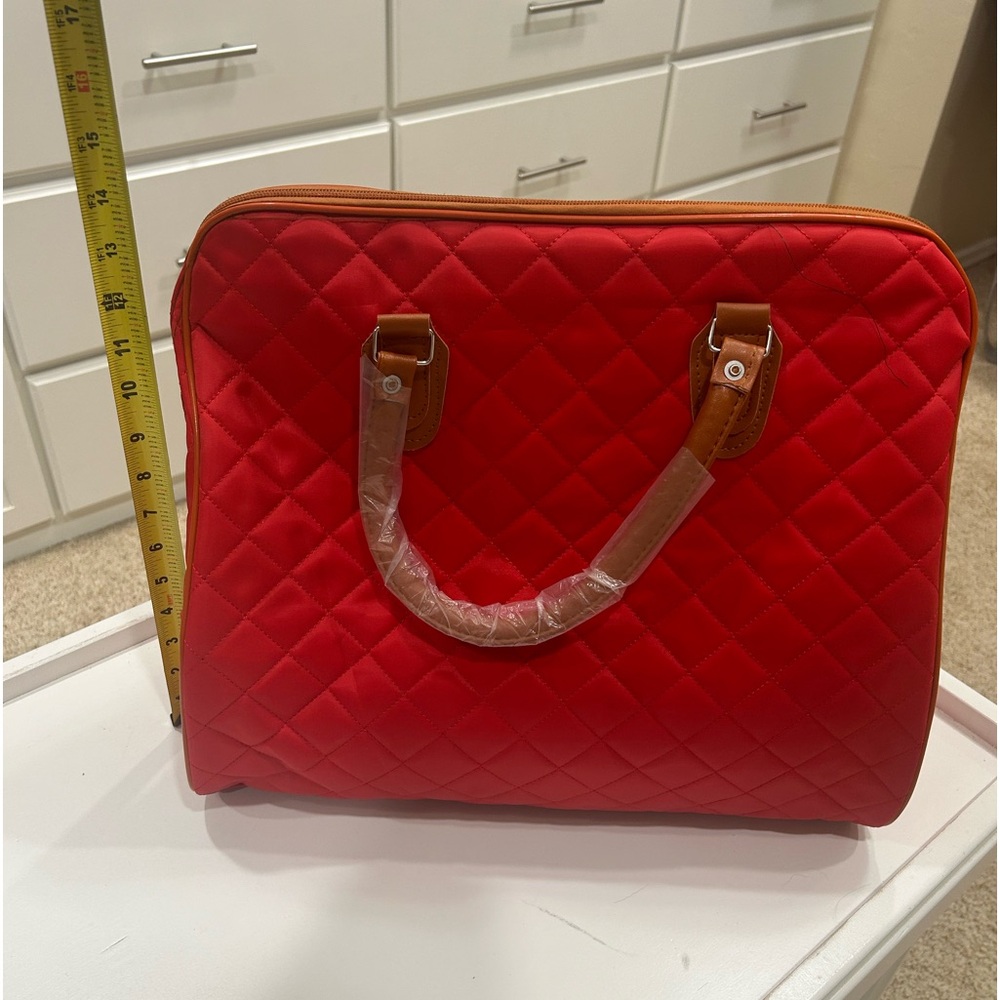 NWOT red weekender bag.